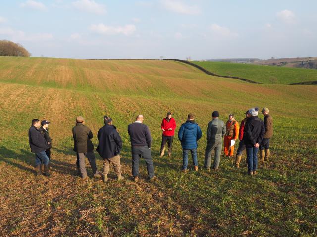 Farmers stood in field for a talk